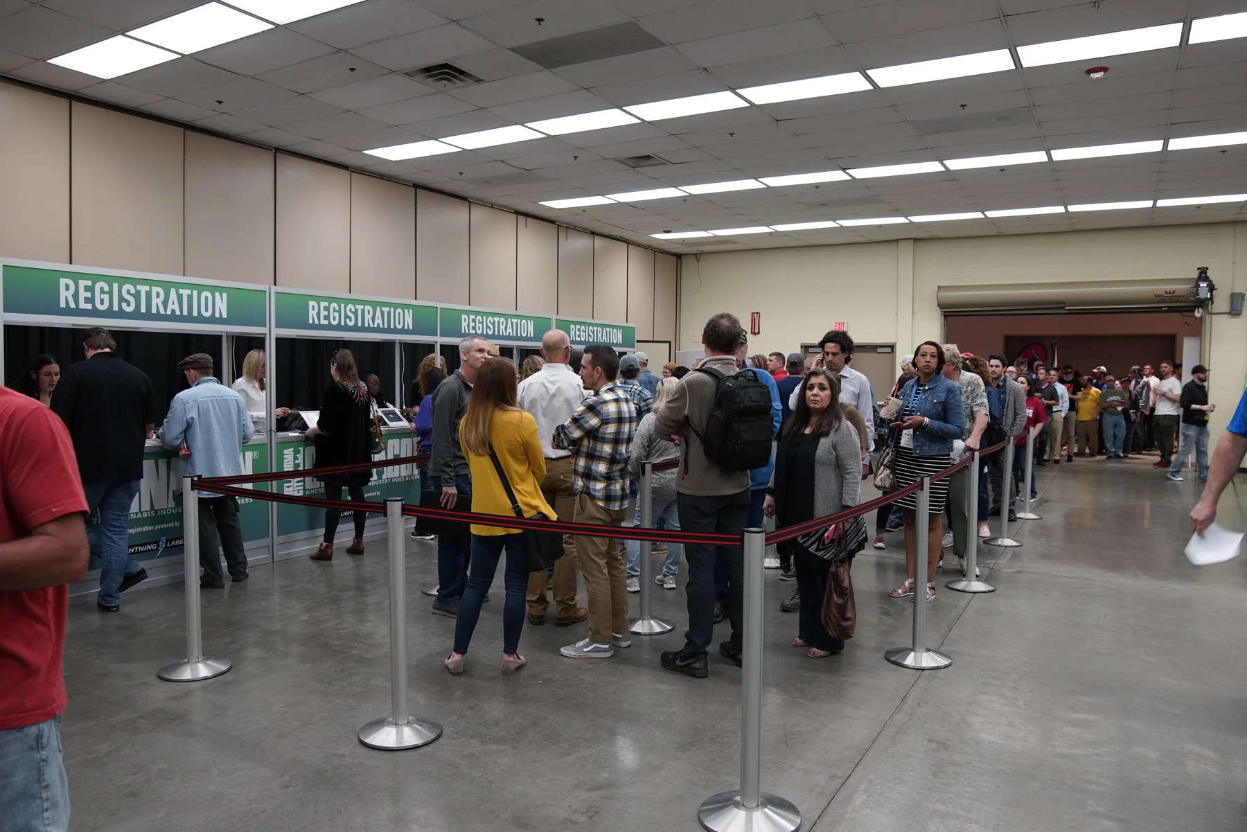 CannaCon attendees checking in at the event registration counters.